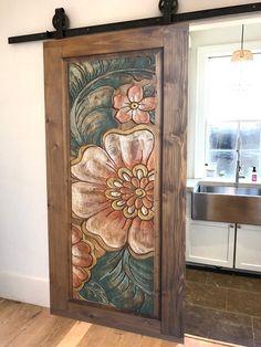 an open door with flowers painted on it