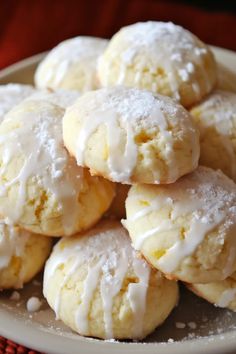 a white plate topped with sugar cookies covered in icing