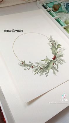 the inside of a christmas card with holly and mist on it, next to other cards