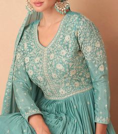 COLOR : Sea Green FABRIC : Top, Bottom & Dupatta - Premium Chinon Silk WORK : Resham Embroidery, Hand Work, Sequins, Motifs, Lace Border OCCASION : Wedding, Reception, Party Wear, Festival READY-TO-WEAR : No STITCHING : Available as semi-stitched fabric, can be stitched using standard size option (+$30). Note: There might be a slight color variation due to lighting and flash used during photoshoot. The bright shade seen is the best closer view of fabric's color. Fitted Floor-length Salwar Kameez With Floral Embroidery, Reception Embroidered Chinon Sets, Embroidered Chinon Sets For Reception, Embroidered Semi-stitched Salwar Kameez For Reception, Embroidered Chanderi Sets Floor-length, Embroidered Chanderi Floor-length Sets, Festive Floor-length Sets With Floral Embroidery, Anarkali Embroidered Dress With Semi-stitched Fit, Fitted Anarkali Sets With Intricate Embroidery