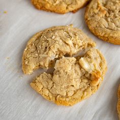 some cookies are sitting on a white table