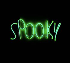 a neon sign that says spooky in the middle of it's image