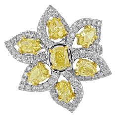 Very Beautiful & Exotic Flower Ring. The ring is PLT 950/18K White & Yellow Gold There are 3.46 Carats in Natural Fancy Yellow Diamonds VS Clarity There are 1.78 Carats in White Diamonds F VS The ring is a size 7, not sizable. The flower top is about 1" wide. The ring weighs 16.8 grams Wide Band Diamond Rings, Argentium Silver Jewelry, Stars Jewelry, Canary Diamond, Gold Flower Ring, Expensive Jewelry Luxury, Fancy Yellow Diamond, Yellow Gold Diamond Ring, Wonderful Flowers