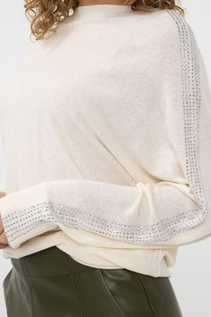 This beige sweater features studded detailing down both sleeves, adding a touch of edginess to a classic piece. Perfect for adding a bit of personality to your wardrobe, pair with dark wash denim and silver flats for an elevated look! Women’s Silver Sweaters, Studded Sweater, Silver Flats, Pull Sweat, Beige Sweater, Dark Wash Denim, Resort Style, Sweater Sleeves, Sleeve Sweater