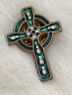 vintage enamel Celtic Cross lapel pin.  vintage  Irish infinity circle  Celtic Design  Goldtone cross with green and white enamel.  Resembles world class stained glass masters art representing culture from Ireland, Wales, Britain, Europe, Scotland.   1.25" x .75" Email any questions prior to purchase.  Study all photos as they are a  large part of the description. No return refunds or exchanges White Pin, Celtic Design, Palm Coast, Celtic Cross, Celtic Designs, White Enamel, Lapel Pin, Green And White, Lapel Pins