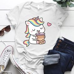 Unleash your inner kawaii with our Boba Tea Unicorn T-Shirt! This playful fashion statement is perfect for adding a touch of whimsy to any outfit. Satisfy your quirky cravings with this unique tee (and boba tea, of course!). Material: Polyester Kawaii Boba Tea, Kawaii Boba, Playful Fashion, Umbrella Decorations, Bags Game, Unicorn Tshirt, Boba Tea, Slipper Boots, Cozy Fall