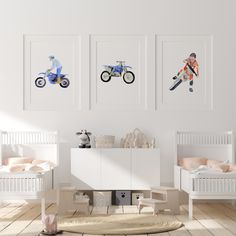 a room with three pictures on the wall and two children's beds in it