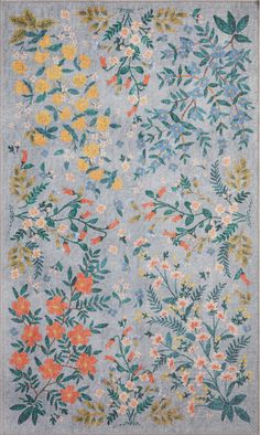 a blue rug with flowers and leaves on it