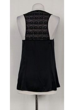 This black embellished tank isn't your typical top, so go on and show it off! From Nannette Lepore, this tank is jazzed up with a jeweled front panel with mini bows and chain link detail, as well as a beautiful lace back. Add this top to any look for an air of elegance! Truly the perfect addition to any sophisticated ensemble. Size 6 100% silk Ribbed straps and collar Hidden snap button panel Jeweled panel with black bows and chain link detail Racer-back cut made of sheer lace Bust: 28" Shoulder Embellished Stretch Tank Top For Night Out, Chic Embellished Stretch Tank Top, Fitted Summer Camisole With Lace Back, Fitted Lace-back Camisole For Summer, Fitted Lace Back Camisole For Summer, Party Cami Tank Top With Lace Trim, Spring Embellished Stretch Tank Top, Spring Stretch Embellished Tank Top, Summer Evening Lace Top Camisole