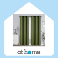 a green curtain hanging from the side of a window in front of a white dresser