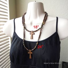 "I designed this earthy looking casual cross necklace for men and women, by combining natural materials: Robles wood cross in shade of light to dark brown, Bloodstone round beads in multi-colors of green, mustard, maroon, tan etc. with characteristic red spots which said to be blood of Christ in legend, and coconut palm wood beads in a brown hue. I have also added some antiqued brass spacers for a touch of vintage look, and finished off with a lobster clasp in antiqued brass. Lead-safe. The pict Bohemian Brown Cross Necklace, Brown Bohemian Cross Necklace, Brown Crucifix Necklace In Spiritual Style, Brown Spiritual Necklace With Cross Pendant, Adjustable Brown Cross Necklace, Spiritual Brown Crucifix Necklace, Spiritual Brown Cross Necklace, Brown Wooden Beads Cross Necklace, Brown Cross Necklace With Wooden Beads