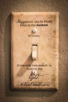 an old light switch plate with a quote on it