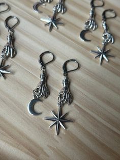 These handmade earrings are special and unique, the hands that grab the moon and stars are the perfect gift for someone who loves space and the night sky!  Handmade in Indiana, USA Handmade Metal Witchy Earrings, Handmade Witchy Dangle Earrings, Magical Handmade Dangle Earrings, Handmade Magical Dangle Earrings, Handmade Silver Witchy Earrings, Nickel Free Sterling Silver Witchy Earrings, Nickel-free Sterling Silver Witchy Earrings, Handmade Star-shaped Magical Jewelry, Gothic Silver Star Earrings