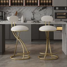 two white stools sitting next to each other in front of a marble counter top