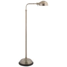 a lamp that is on top of a metal pole with a white light behind it