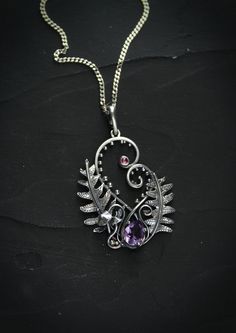 ITEM DESCRIPTION: The size H 4 cm x W 3 cm (1 2/3 x 1 inch). Weight - 5 g. You can buy it with a silver chain or without. I made this amazing Fern necklace of sterling silver, natural amethyst, and rhodolite garnet. This is a real piece of the mysterious woodland: fern leaves, grass, and mushrooms. Perfect botanical pendant for nature lovers! From my childhood, I have heard a Ukrainian legend about blooming ferns. Anyone who finds a flower of ferns during the shortest night will have happiness, Handmade Heart Pendant Necklace, Nature-inspired, Handmade Heart Pendant Necklace With Nature-inspired Style, Silver Engraved Nature-inspired Necklace, Sterling Silver Flower Pendant With Oxidized Finish, Nature-inspired Engraved Sterling Silver Necklace, Nature-inspired Engraved Silver Jewelry, Silver Leaf-shaped Nature-inspired Necklace, Silver Nature-inspired Round Pendant Jewelry, Unique Nickel-free Leaf-shaped Jewelry