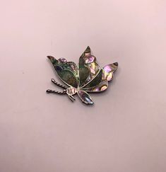 Vintage large heavy Taxco Sterling silver 925 Abalone crushed stone butterfly brooch This is a large Heavy brooch Featuring a butterfly with stunning iridescent abalone and crushed stone inlay Marked Taxco 925 sterling on the back 16.8 gram weight Roll over clasp In very good vintage condition. Light scratches and tarnish to the back. 2 3/4 inch tall 2 inches wide Sterling Silver Jewelry With Butterfly Clasp, Iridescent Brooch Jewelry For Gifts, Iridescent Brooch Jewelry Gift, Silver Sterling Butterfly Necklace With Butterfly Clasp, Vintage Silver Brooch With Gemstone, Vintage Silver Abalone Shell Jewelry, Collar Pins, Oyster Pearl, Antique Silver Multi-stone Brooches