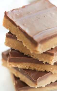 chocolate and peanut butter bars stacked on top of each other