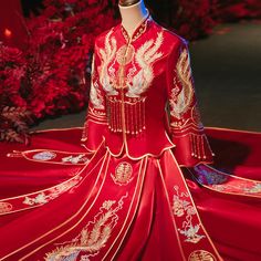 This stunning Qun Kwa is a traditional Chinese wedding dress, featuring a rich red color that symbolizes good luck, happiness, and prosperity. The dress is intricately embroidered with golden phoenix motifs, which are symbols of femininity, grace, and harmony in Chinese culture. Made from satin fabric, ensuring both comfort and elegance. Pair it with a dragon tang suit (ma gua), representing the perfect balance between yin and yang Size Guide: Please refer to the size guide picture before placin Traditional Ceremony Gown For Festivals, Traditional Wedding Dress For Ceremonies, Traditional Embroidered Wedding Dress For Festive Season, Traditional Red Gown For Marriage, Embroidered Floor-length Wedding Dress For Traditional Ceremonies, Festive Embroidered Wedding Dress For Traditional Ceremonies, Traditional Red Ceremonial Dress, Ceremonial Red Dress With Traditional Patterns, Traditional Red Dress For Marriage