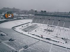 an aerial view of a hockey stadium in the snow