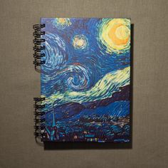 a spiral notebook with an image of the starry night painting on it's cover