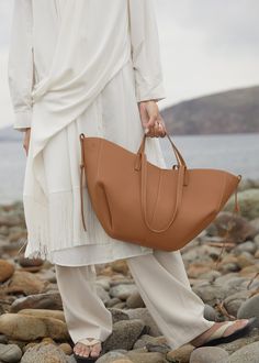 [vc_row][vc_column width=”1/3″][vc_column_text text_larger=”no”] Polene Polene Cyme Edition Textured Camel Cyme Edition Textured Camel This sculptured tote bag featuring waves, folds, Karl Lagerfeld Bag, Polene Bag, Bucket Handbags, Leather Bag Women, Women's Bags, Leather Tote Bag, Fashion Handbags, Womens Tote Bags, Luggage Bags