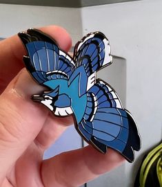 "A part of the songbird series for the 'Sky of Jewels' hard enamel pin series first found on Kickstarter, this Blue Jay hard enamel pin is a celebration of the beauty of the songbirds that are found in so many of our backyards! 2.80\" wide from wingtip to wingtip Nickel Black Finish Backer Card Two Clutches (Your choice!) Rubber Clutches: Good for hats, clothes, or any time a metal back might irritate your skin. Butterfly Metal Clutches: Good for bags, collars, and pin boards. Locking Clutch: Go Enamel Pin Ideas, Cool Enamel Pins, Blue Jay Inspired Fashion, Animal Pins, Blue Enamel Pin For Gift, Unique Enamel Collectible Pin, Blue Enamel Pins For Gifts, Dragon Enamel Pin, Wolf Enamel Pin