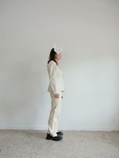 Off White Italian made Leather suit  high waisted, flared trousers and chic blazer  Softest Lambs Leather and fully lined.  Just amazing I bought this to wear for my spring Copenhagen registry wedding but now we are doing it in summer NZ! perfect for something like this or an event.  good  Vintage Condition, minor signs of wear to be expected of white second hand item nothing in particular to mention or that reflects wear  Size M fits more like 6-8 as vintage runs small  Pictured on UK 6 5'5  Me Beige Workwear Sets For Spring, Beige Sets For Workwear In Spring, Beige Fall Workwear Pantsuit, Fall Beige Pantsuit For Workwear, Beige Fall Pantsuit For Work, Structured Spring Pantsuit For Workwear, Spring Structured Pantsuit For Workwear, Beige Workwear Sets With Straight Pants, Beige Fitted Wide Leg Set