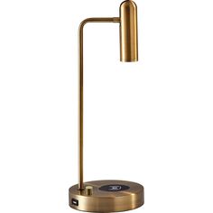 a gold lamp with a black base and a white light on the top of it