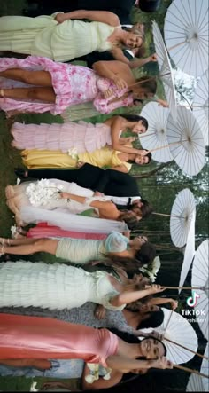 a group of women standing next to each other holding umbrellas