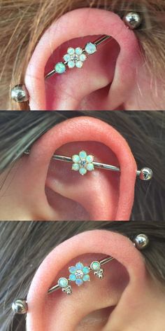 three different types of ear piercings with flowers on them, one in the middle