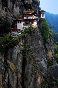 a mountain side with some buildings on it