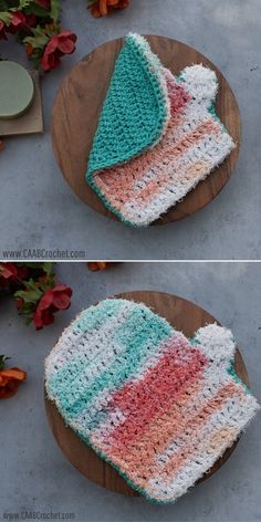 crocheted dishcloths are sitting on a wooden plate