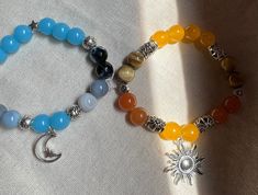 sun and moon crystal beaded bracelets!  -  sun- yellow calcite, orange aventurine & yellow tigers eye - moon- blue lace agate, glass beads & faceted agate - - appearance and veining of stones will vary! will not look exactly as pictured. Handmade Celestial Beaded Bracelets With Round Beads, Yellow Tigers Eye, Crystal Beaded Bracelets, Orange Aventurine, Moon Bracelet, Yellow Calcite, Moon Crystal, Crystal Beads Bracelet, Matching Jewelry