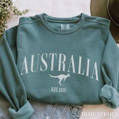 This Australia sweatshirt is the perfect item to remember your Aussie vacation or celebrate Australia Day.  Luxurious comfort and style are what this unisex, garment-dyed sweatshirt is all about. It's made with 80% ring-spun cotton and 20% polyester and the fabric is 3-end garment-dyed, ring-spun, color-blast fleece with a 100% cotton face. Each sweatshirt comes with a relaxed fit, a rolled-forward shoulder, and a back neck patch.  .: 80% ring-spun cotton, 20% polyester .: Medium-heavy fabric (9 Salem Massachusetts, Floral Blanket, Dyed Sweatshirt, Comfort Colors Sweatshirt, Australia Day, Hoodie Design, Back Neck, Vacation Trips, Heavy Fabric