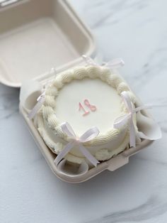 a cake in a box with the number twenty on it