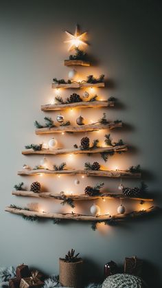 Rustic wall-mounted driftwood Christmas tree with lights and pine accents Non Traditional Christmas Tree, Driftwood Christmas Decorations, Christmas Tree Alternatives, Traditional Christmas Tree Ideas, Wooden Christmas Trees Diy, Natural Christmas Tree, Christmas Tree With Lights, Driftwood Christmas Tree, Christmas Tree Inspo