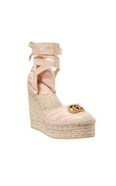 The Gucci collection is the pinnacle of Italian craftsmanship and attention to detail as seen in these dusty pink Leather platform espadrilles. Featuring an almond toe, a branded insole, a high wedge heel, a grosgrain lace-up closure and a gold-tone double G logo on the front.Round toeBraided raffia wedge heelTie-fastening ankle strapSignature interlocking GG logo Quilted finishComposition: Leather 100%, Raffia 100%Lining: Leather 100%Sole: Rubber 100%Made in Italy Chic Gucci Platform Wedge Sandals, Gucci Leather Wedge Sandals For Summer, Chic Gucci Summer Wedge Sandals, Luxury Pink Wedge Heel Sandals, Gucci Wedge Sandals With Platform Heel, Feminine Round Toe Platform Sandals, Feminine Platform Sandals With Round Toe, Chic High Heel Espadrilles With Woven Sole, Luxury Flat Heel Heels For Spring