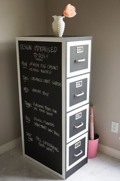 a chalkboard with drawers on top of it