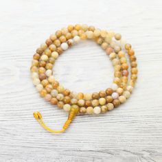 Mala Beads Self-Confidence Yellow Jade Mala ML873 Yellow Spiritual Beaded Necklace With Gemstone Beads, Yellow Hand-strung Jewelry For Meditation, Spiritual Hand-strung Amber Beaded Necklaces, Gold Healing Mala With 108 Beads, Gold Mala With 108 Beads For Healing, 8mm Amber Beads For Spiritual Use, Spiritual Necklace With 108 Natural Beads, 8mm Amber Spiritual Beads, Adjustable Gold Mala With 8mm Beads