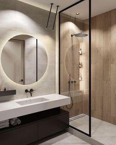 a bathroom with a sink, mirror and shower stall in it's center area