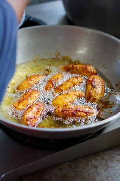 some food is being cooked in a frying pan