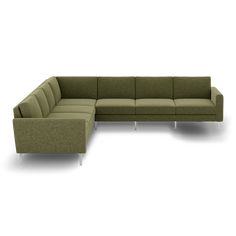 a green sectional couch with white legs on an isolated background, viewed from the front