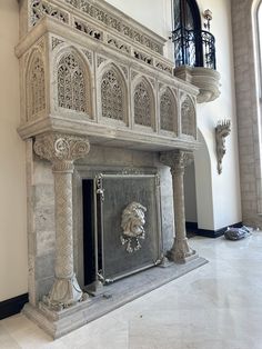 an ornate fireplace in the middle of a room