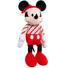 a mickey mouse stuffed animal wearing a santa hat