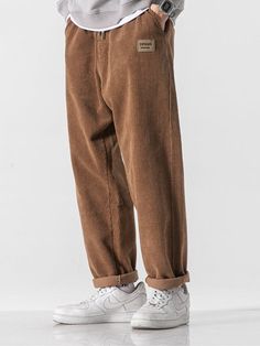 Add a cozy touch to your Soft Boy aesthetic with these Corduroy Jogger Pants. Crafted from premium cotton, the pants offer unbeatable comfort and style. The elasticated waist with a tie and ankle cuffs ensure a snug fit, while the cuffed hem adds a stylish twist. Featuring twin front pockets for added convenience, these joggers will quickly become your go-to choice for laid-back looks. Soft boy aesthetic Elasticated ankle cuffs Elasticated waist with tie Cuffed hem Twin front pockets Cotton Cord Cord Pants Outfit Men, Soft Boy Style, Japanese Trousers, Mens Casual Pants, Pants For Men Casual, Soft Boy Aesthetic, Comfort Clothing, Corduroy Pants Men, Pants For Boys