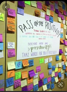 a bulletin board covered in sticky notes and post - it notes that read pass on the positiveness