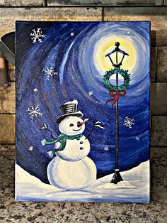 a painting of a snowman with a christmas wreath on it's head and a street light in the background