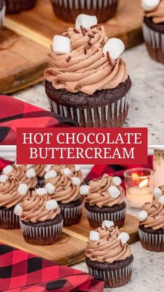 hot chocolate buttercream cupcakes with marshmallows on the top