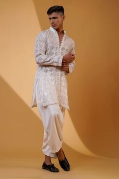 White kurta with sequin motif embroidery and lace details. Paired with a pathani pant. - Aza Fashions Fitted Pants With Intricate Embroidery For Festive Occasions, Festive Fitted Pants With Intricate Embroidery, Festive Fitted Pants With Chikankari Embroidery, Traditional Chikankari Embroidery Wedding Pants, Fitted Pants With Chikankari Embroidery For Weddings, White Sherwani With Printed Motifs For Festivals, White Sherwani With Printed Motifs, Straight Kurta, Festival White Semi-stitched Sherwani, Off White Mens Kurta